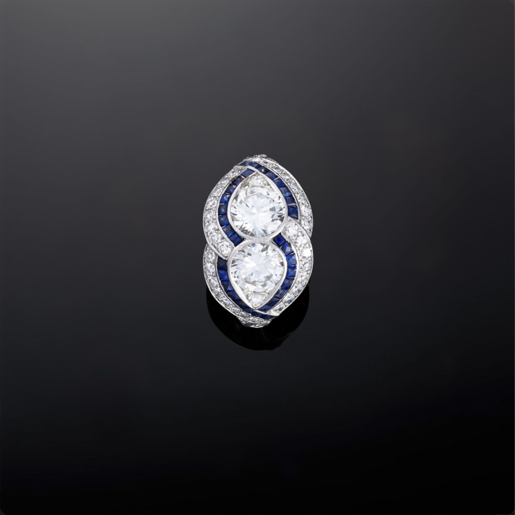 A platinum diamond and sapphire twin ring each round diamond approx 1ct, VVS2/VS1, F/G